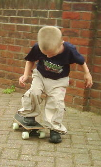 Jono is trying his skateboard